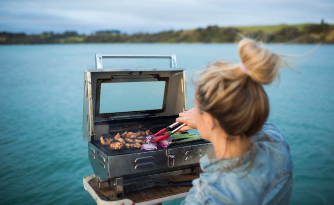 Person cooking on a boat