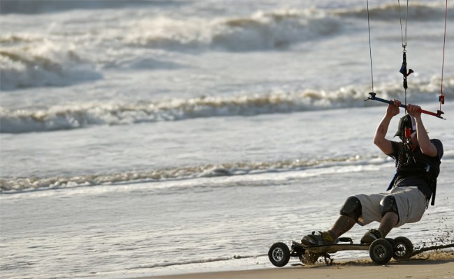 Land boarder on beach